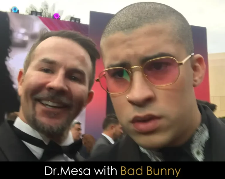 Dr. John Mesa with Grammy Award winner Bad Bunny at a red carpet event.