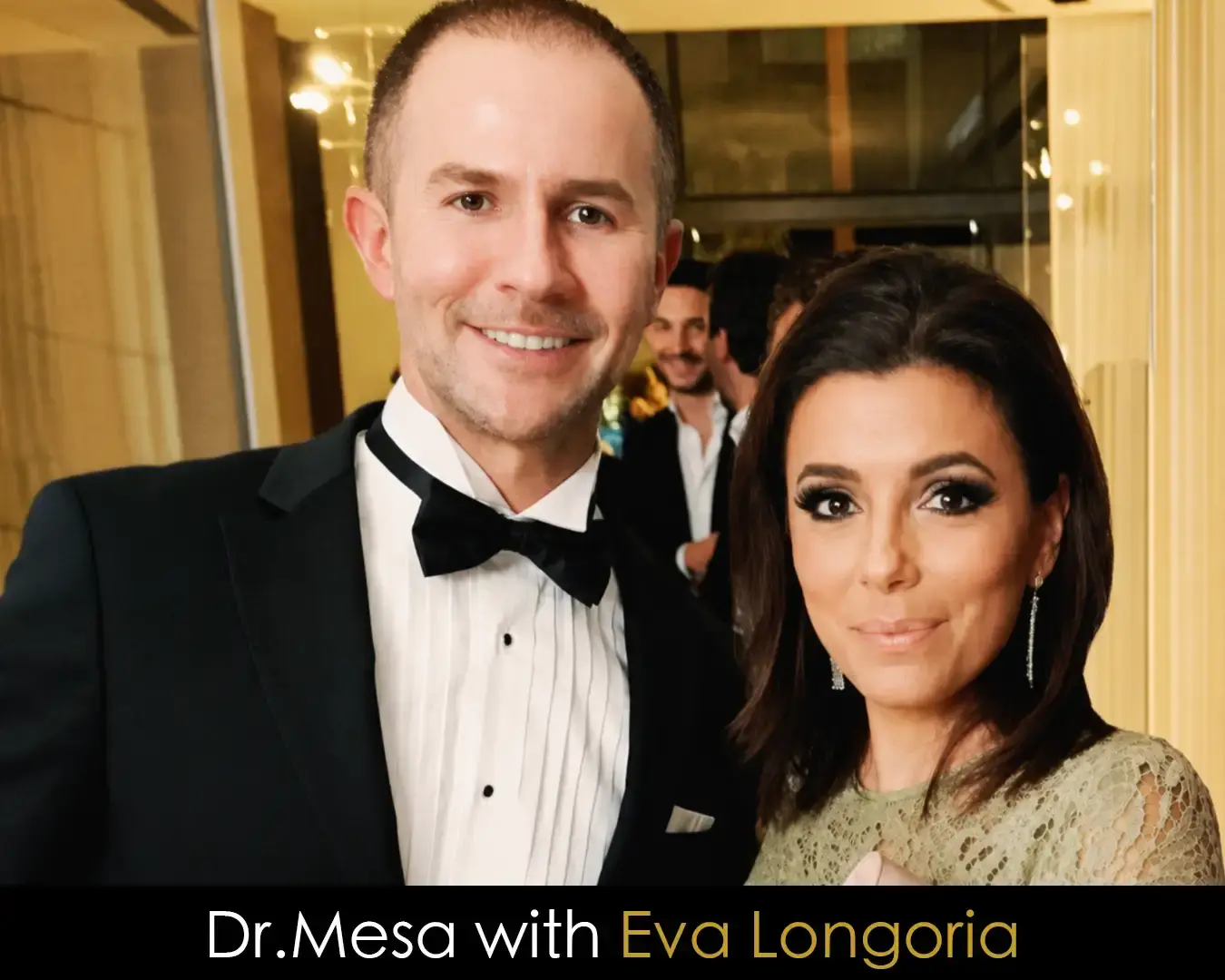 Dr. John Mesa with Eva Longoria at a formal event.